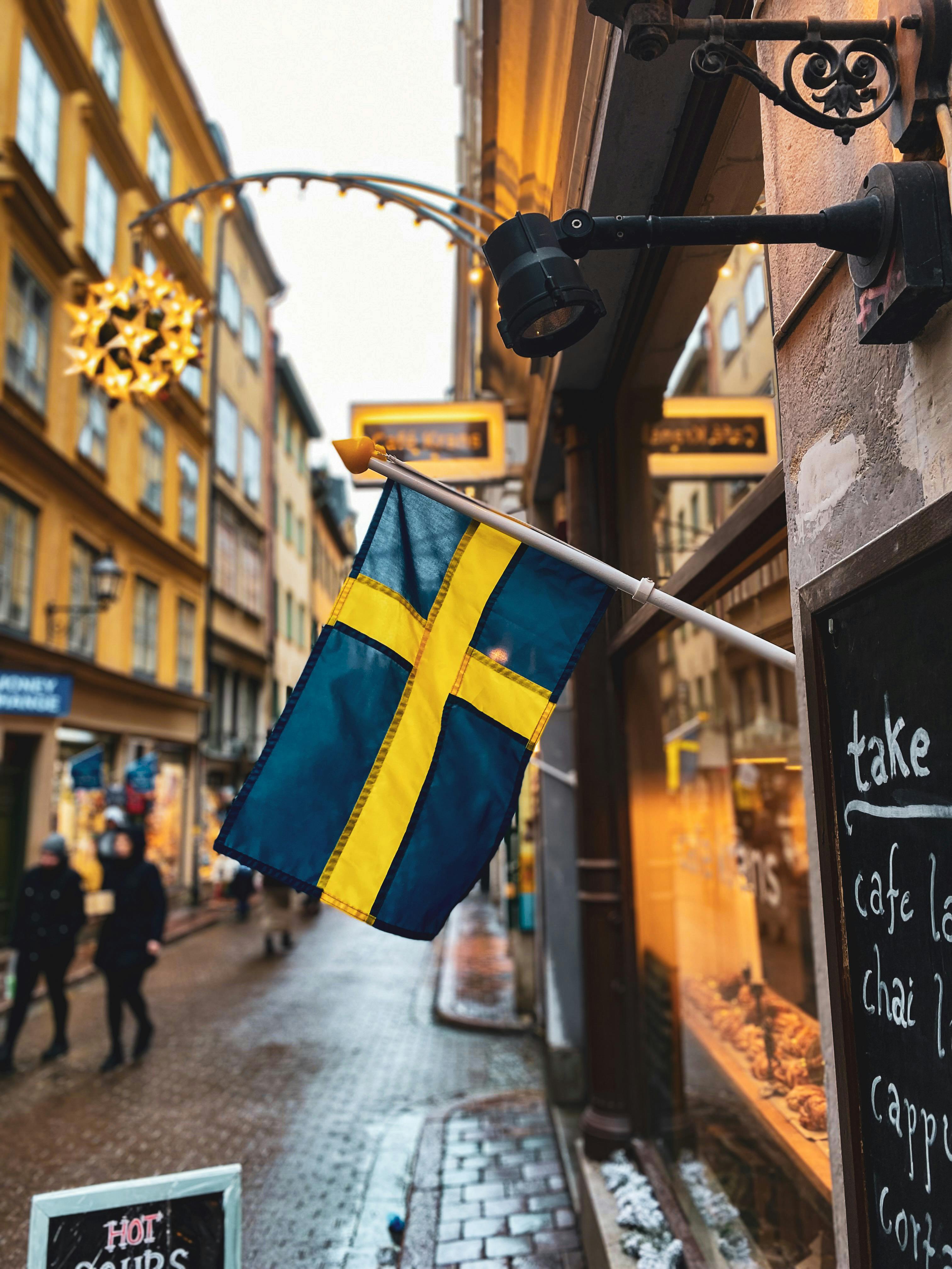Sweden work permit cost — Swedish flag in Stockholm's Gamla Stan old town